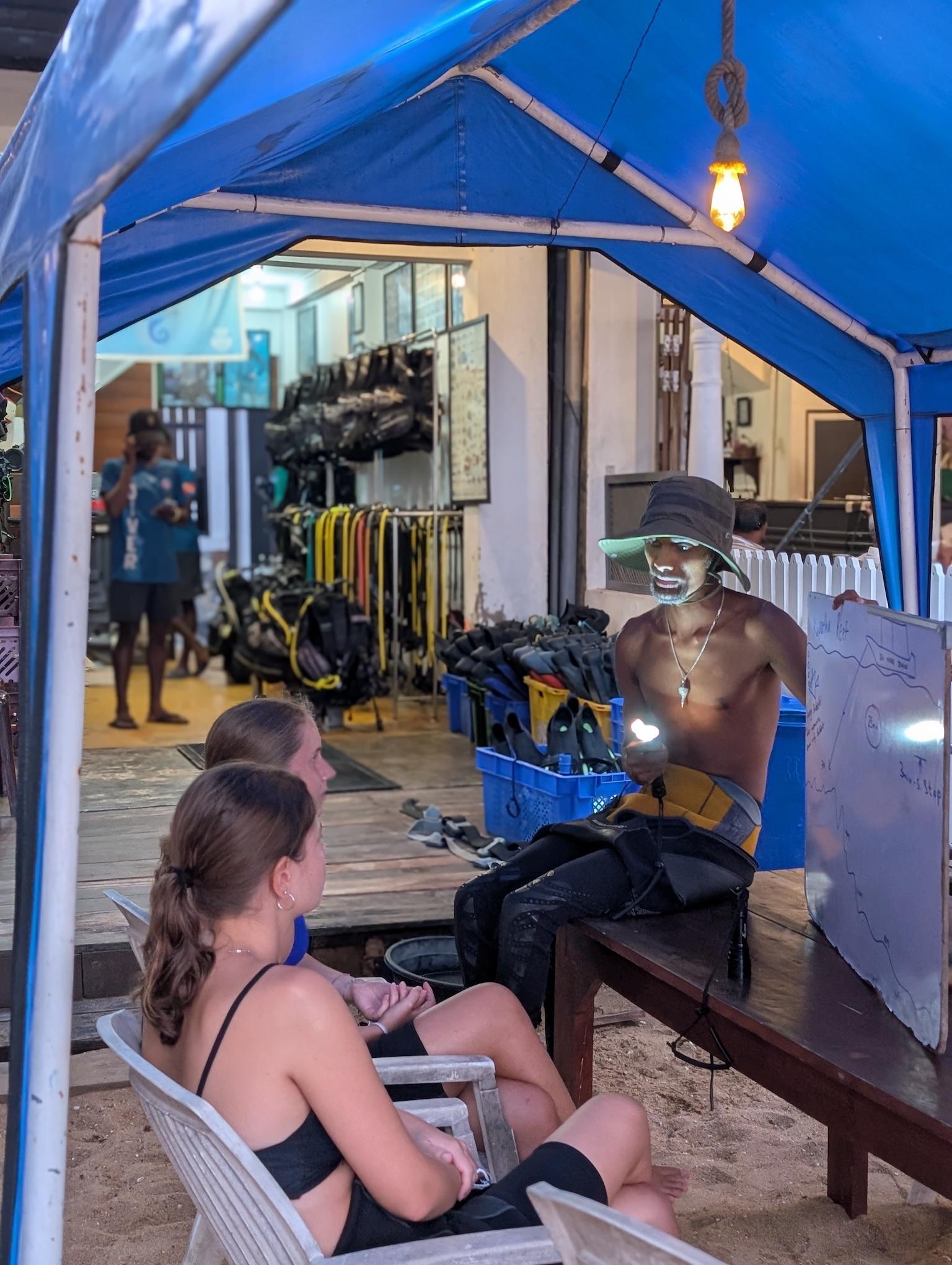 PADI Divemaster Course - image 1: Turn your passion for diving into a professional lifestyle with our PADI Divemaster program. At Hiri Divers, we offer a personalized, hands-on internship experience in the warm, clear waters of Hiriketiya and Dikwella, home to vibrant reefs, blacktip reef sharks, shipwrecks, and the unique Nilwella Underwater Museum featuring sunken buses and helicopters.